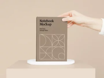 Free Notebook with Hand PSD Mockup