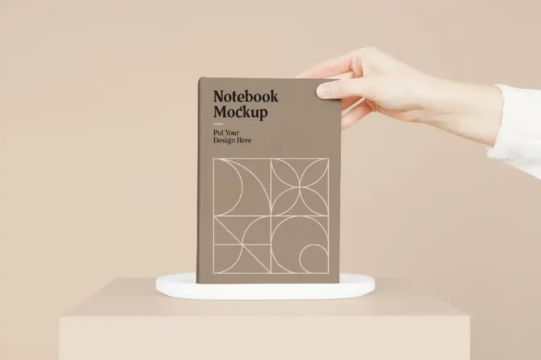 Free Notebook with Hand PSD Mockup