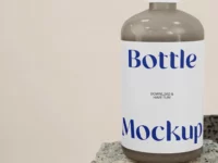 Free Bottle on Stone PSD Mockup