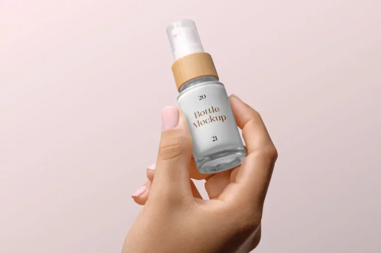 Free Cosmetic Bottle with Woman Hand Mockup